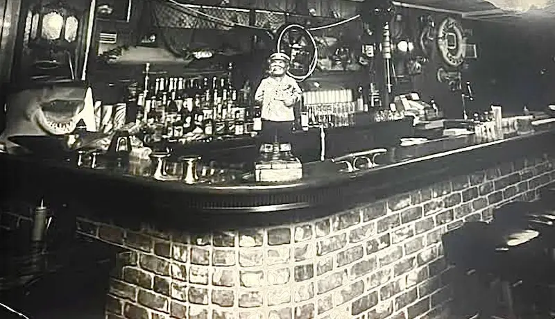 The bar inside the original Mack's WheelHouse restaurant, lined with bottles
