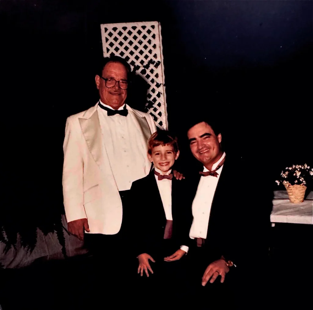 Mack Flowers Sr., Tyler Flowers Sr. and Tyler Flowers Jr. together in formal dress