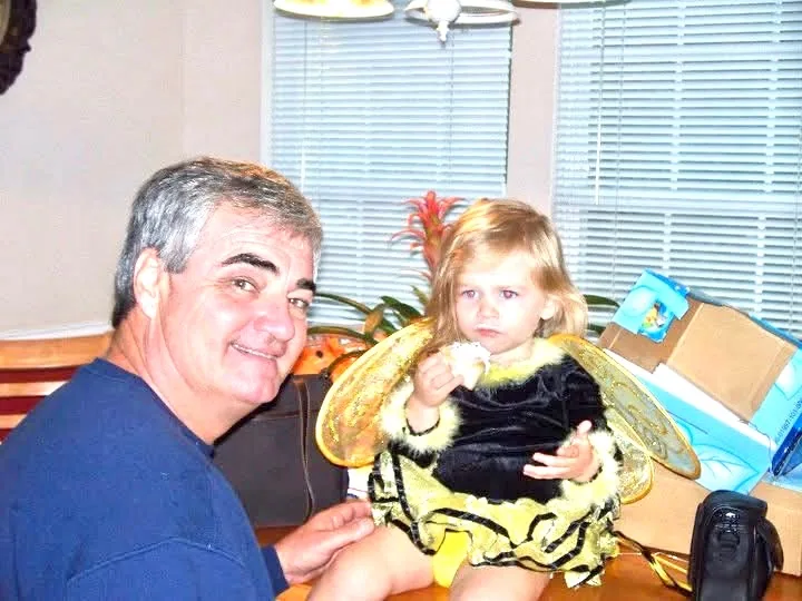 Tyler Flowers Sr. with his granddaughter Caroline dressed as a bumblebee